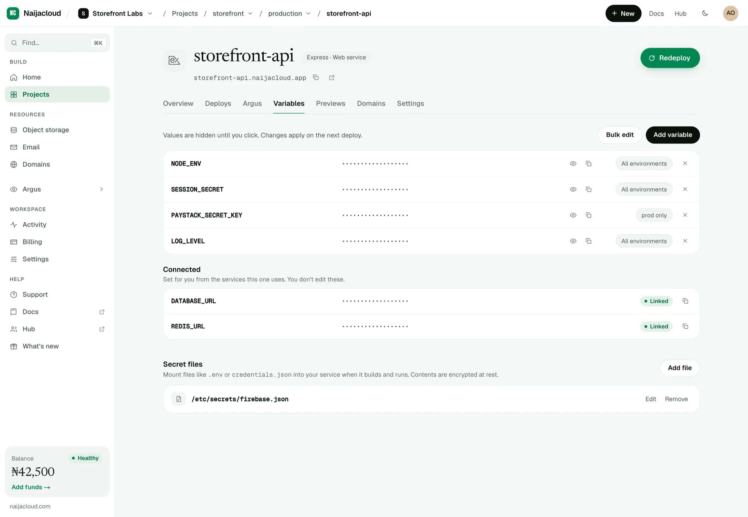 The variables tab of a service, listing environment variables and secret files with masked values